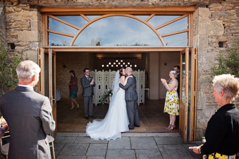 Bride and groom kiss after being announced husband and wife.