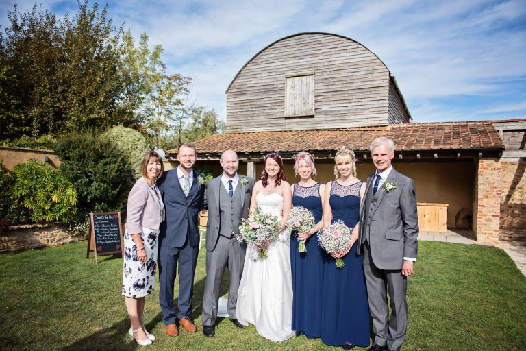 Relaxed but formal family photo.