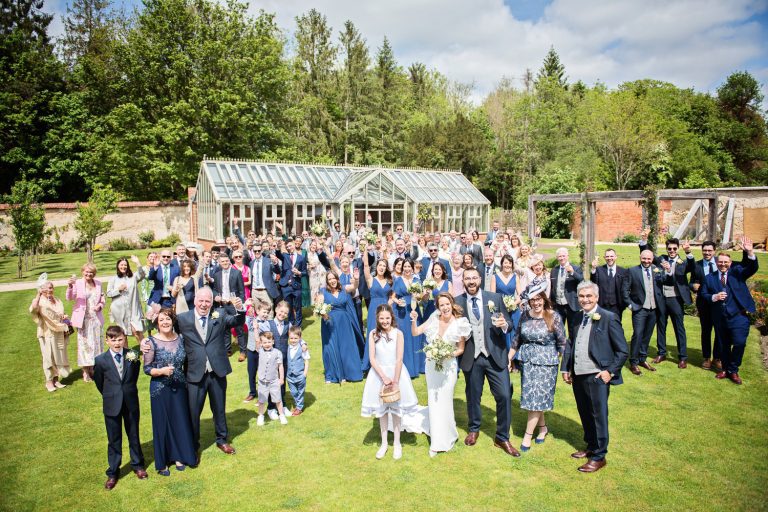 Large group photo of everyone on the lawns at Syrencot.
