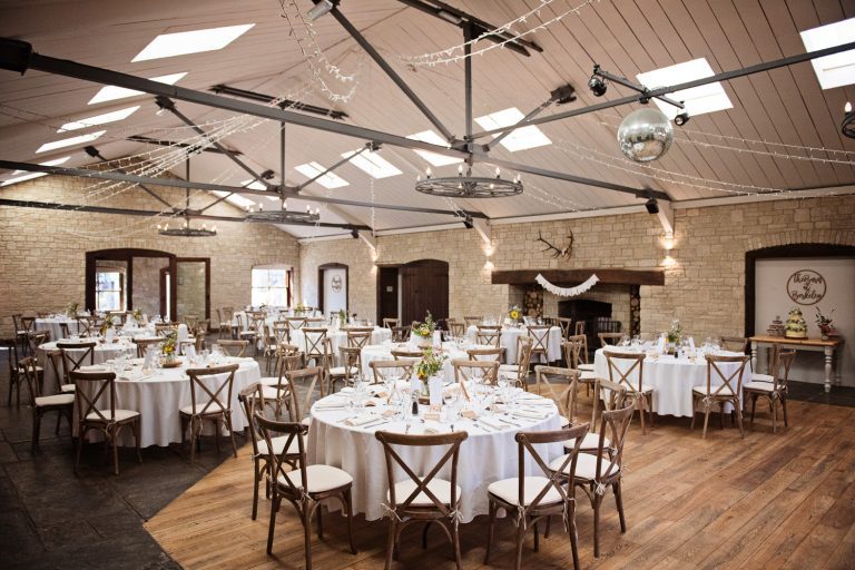Wide shot of the wedding breakfast set up at The Barn at Berkeley.