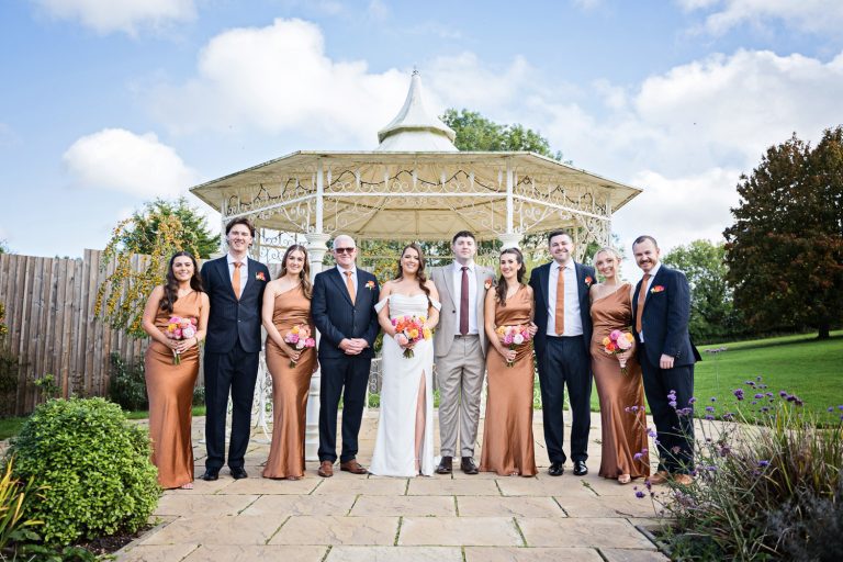 Bridal party in front of the band stand at The Pear Tree, Purton.