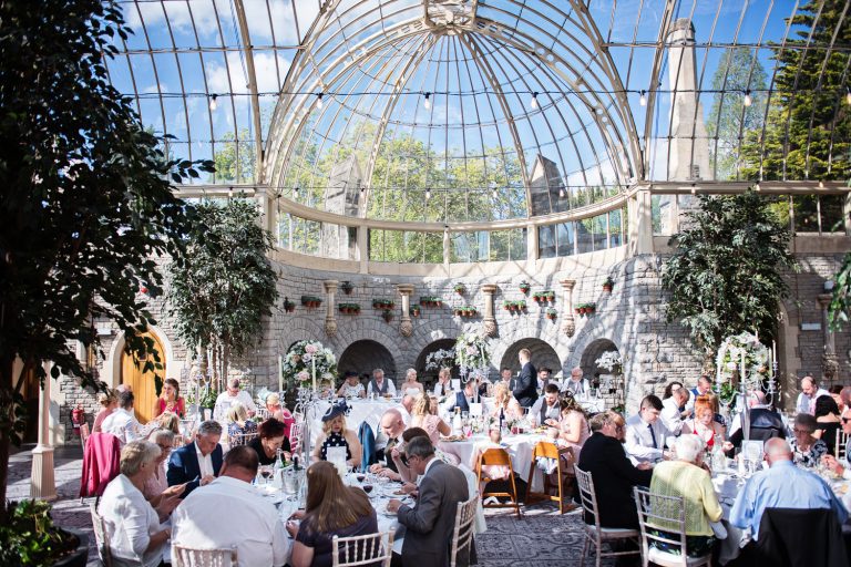 Wedding guests enjoying the Orangery at Tortworth Court.