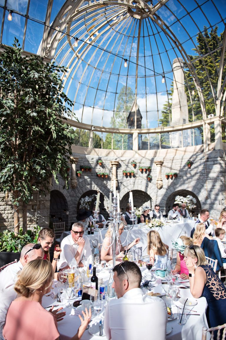Portrait photo of wedding guests enjoying the Orangery.