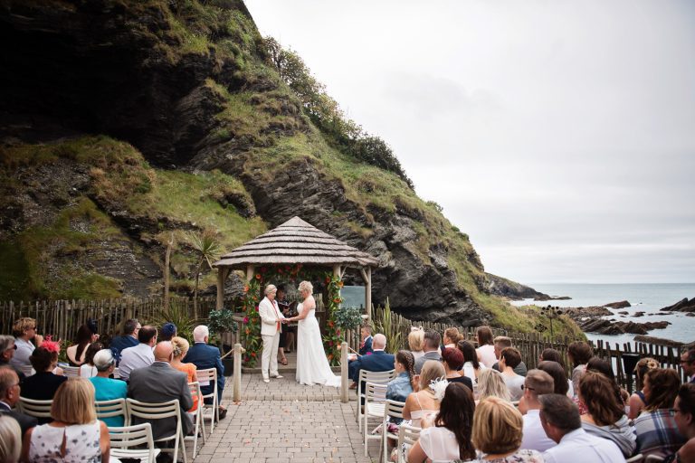 Wedding ceremony taking place at Tunnel Beach, Ifracombe, Devon.