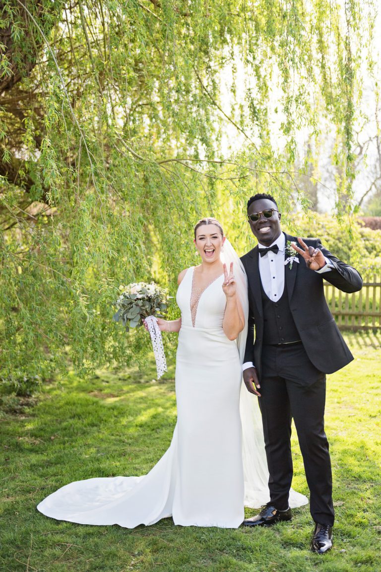 Fun posing by bride and groom.