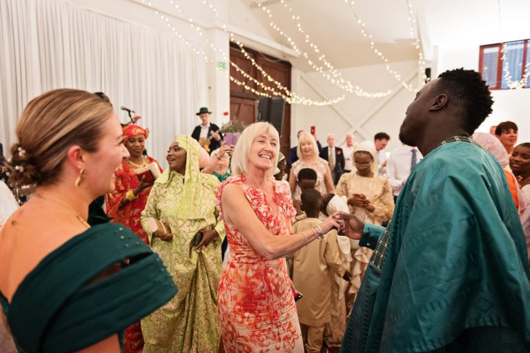 Groom dances with the brides mum, everyone having a good time.