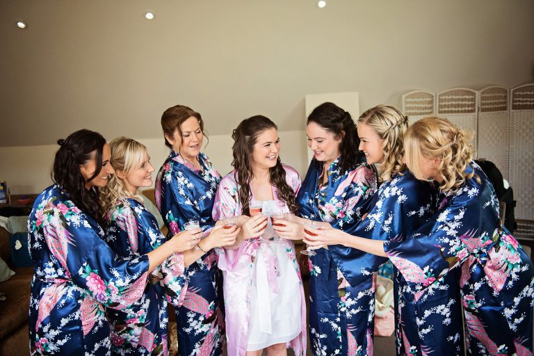 Bridesmaids cheers the bride.