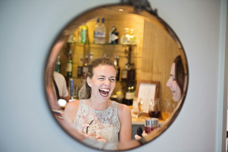 Laughing lady in the mirror.