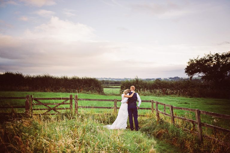 Candid pic Bride and groom grab a moment at golden hour.