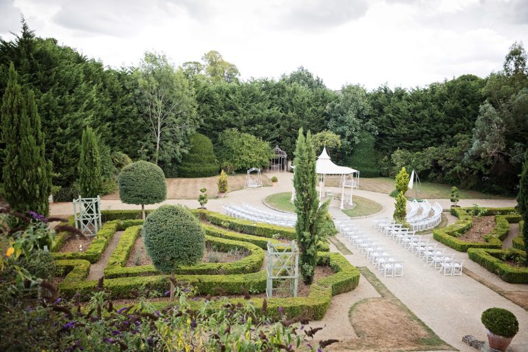 Overview of the ceremony and formal gardens.