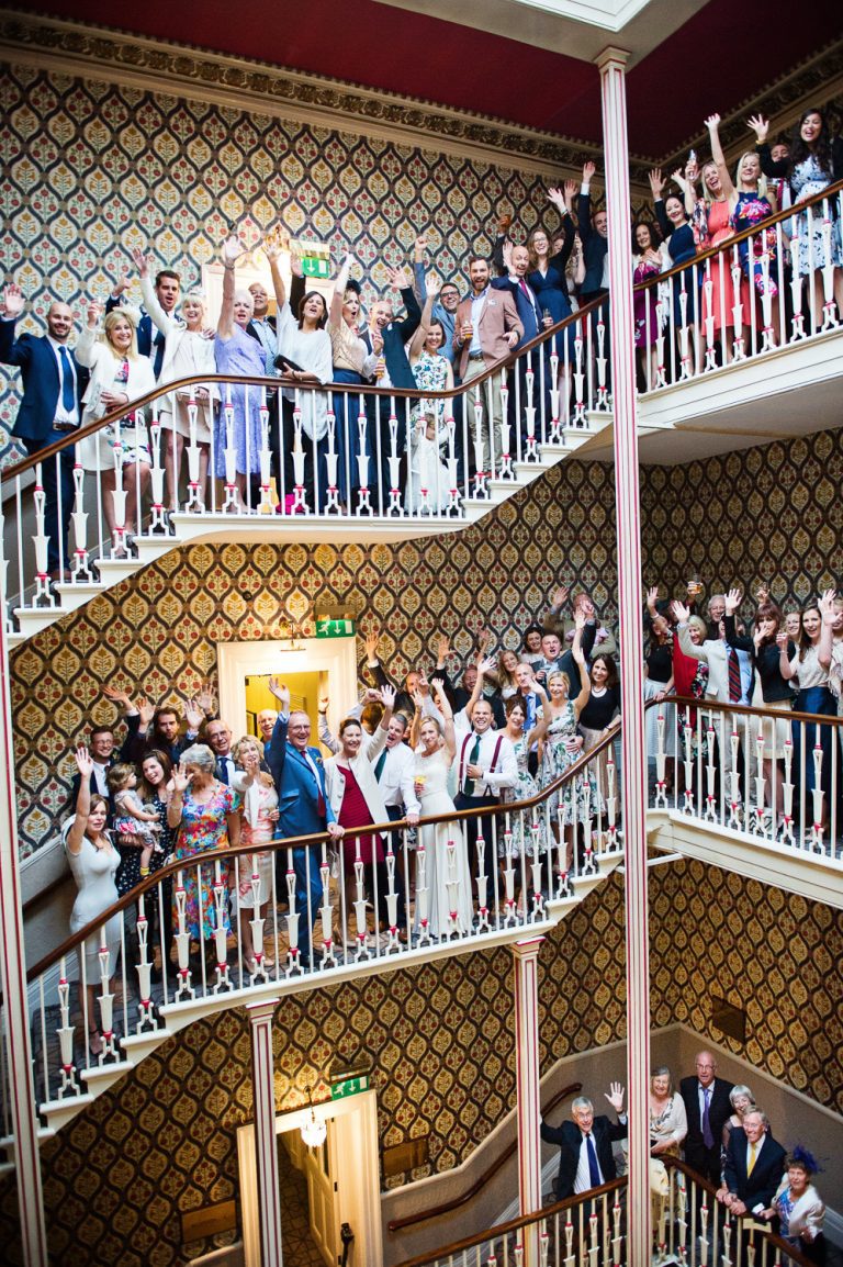 Large group shot on the stairs at Queens Hotel