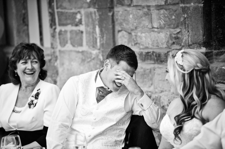 Candid photo of groom holding his head in his hands at Ellenborough Park.