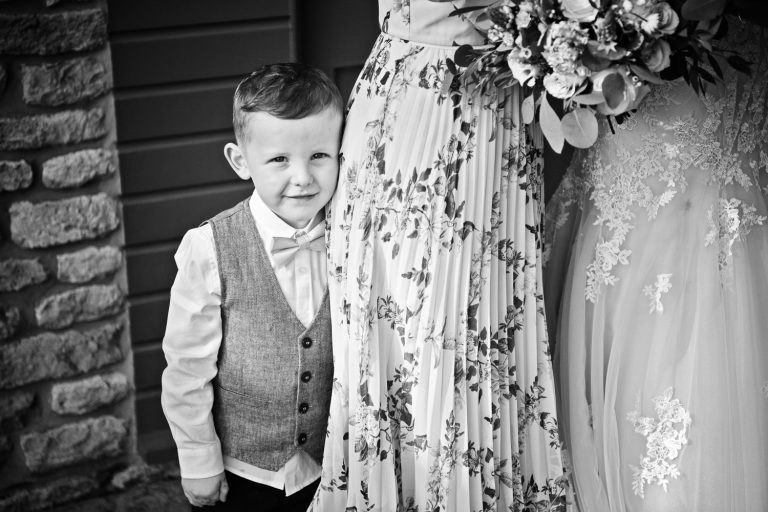 B&W candid photo of child at wedding.