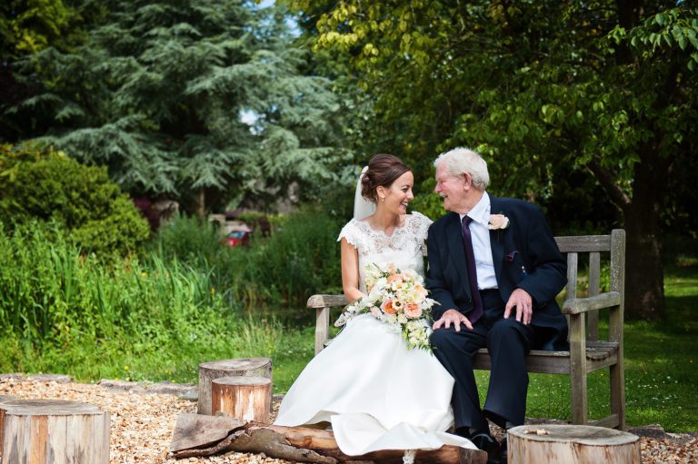 Candid photo of the bride with her grandad at The Slaughters Country Inn