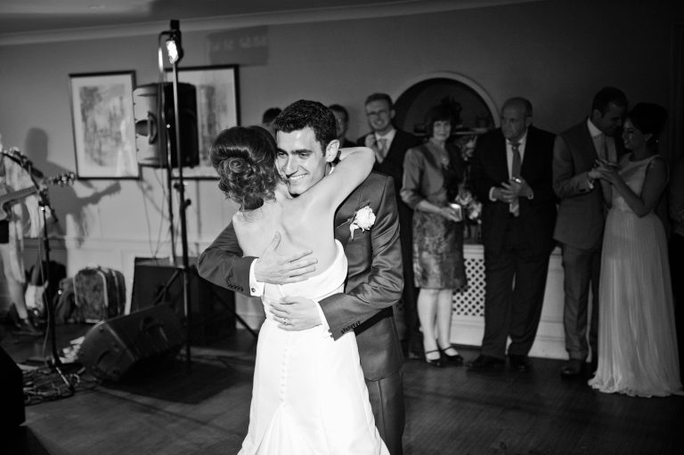 Bride and groom finish their first dance at The Slaughters Country Inn