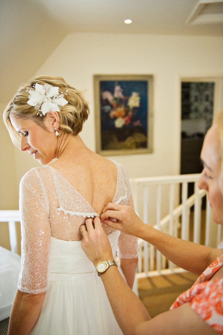 Bride gets ready with her wedding dress.