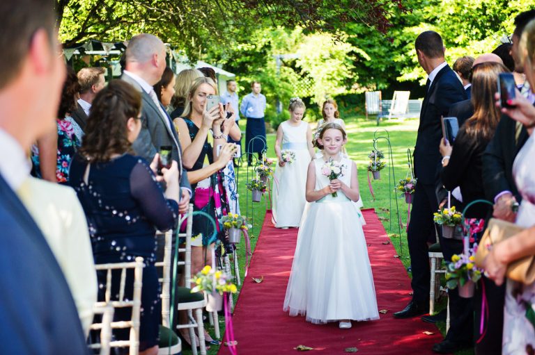 Flowergirls walk down the wedding isle.