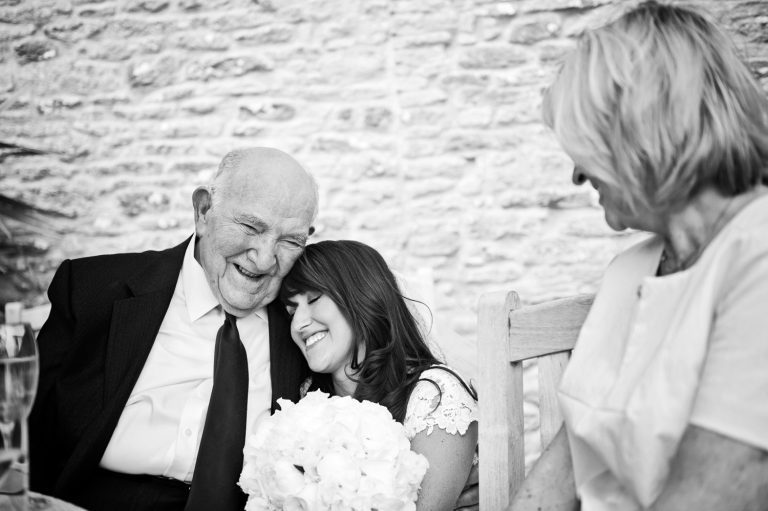 Storytelling documentary photo of bride being with her grandparent. B&W image.