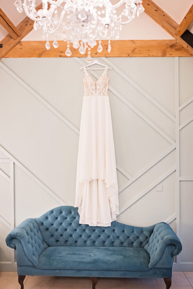 Wedding dress hung up in the new bridal suite at Kingscote Barn.
