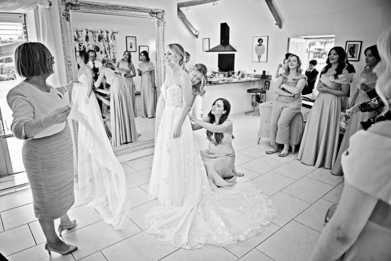 Documentary photo of team bride in the bridal suite at Kingscote Barn.