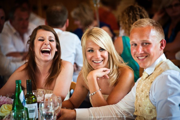Candid photo of wedding guests laughing