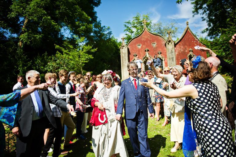 Candid wedding confetti moments at Painswick Rococo Garden