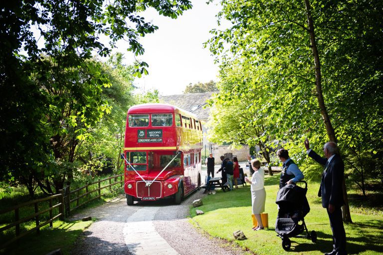 Wedding double decker bus arriving at Rococo Gardens for a wedding.