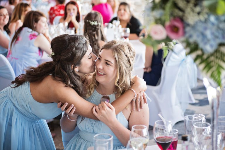 Candid photo of wedding guests at Tewkesbury Park in the Cotswold Suite.