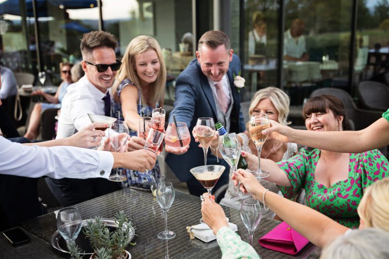 Candid image of wedding guests at Tewkesbury Park