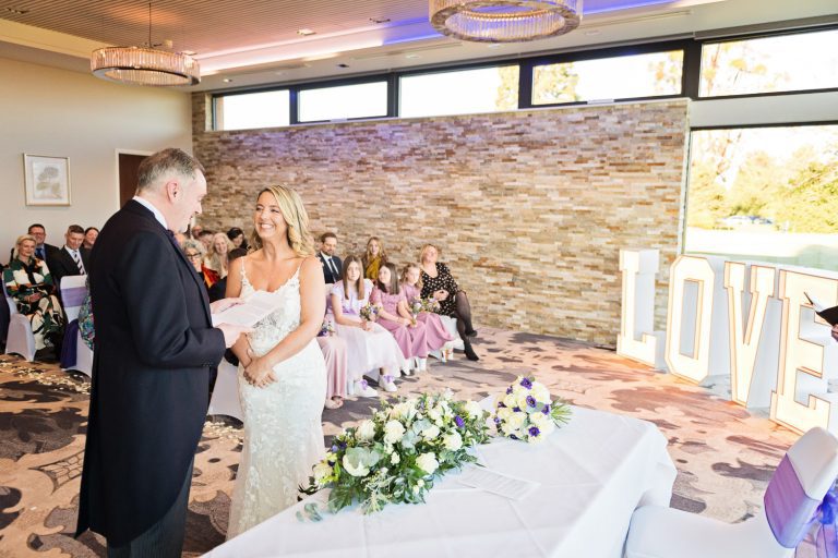 Candid moment of bride and groom getting married at Tewkesbury Park
