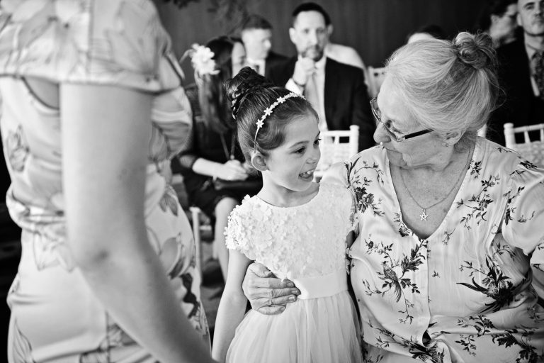 B&W documentary candid photo at a wedding at Tewkesbury Park
