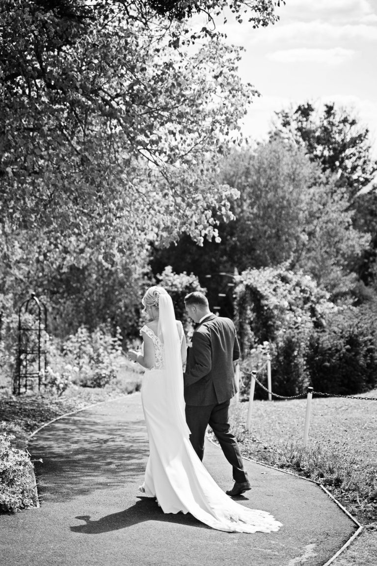 Candid shot of Bride and groom as they grab a moment together at Tewkesbury Park.