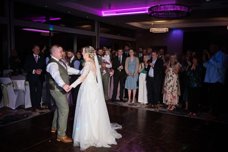 Candid moment of Bride and groom during their first dance at Tewkesbury Park
