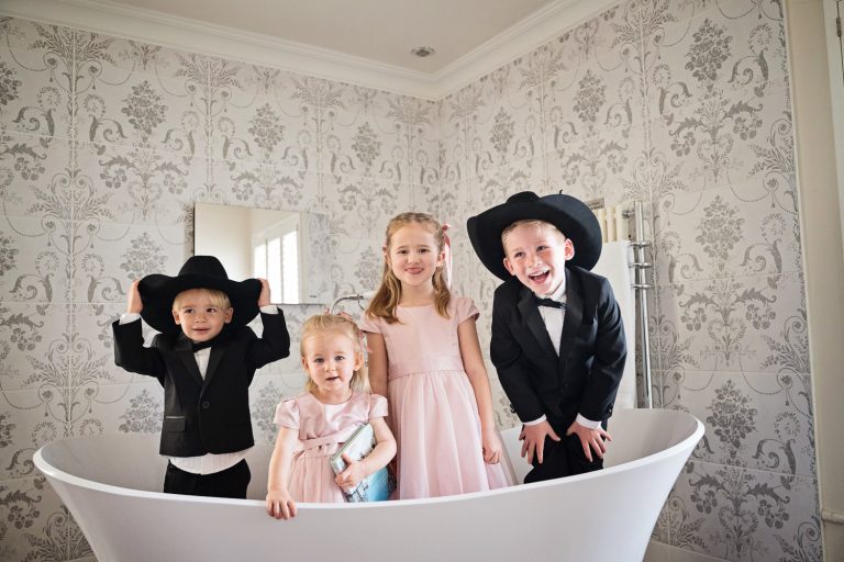 Fun photo of wedding kids in bathtub