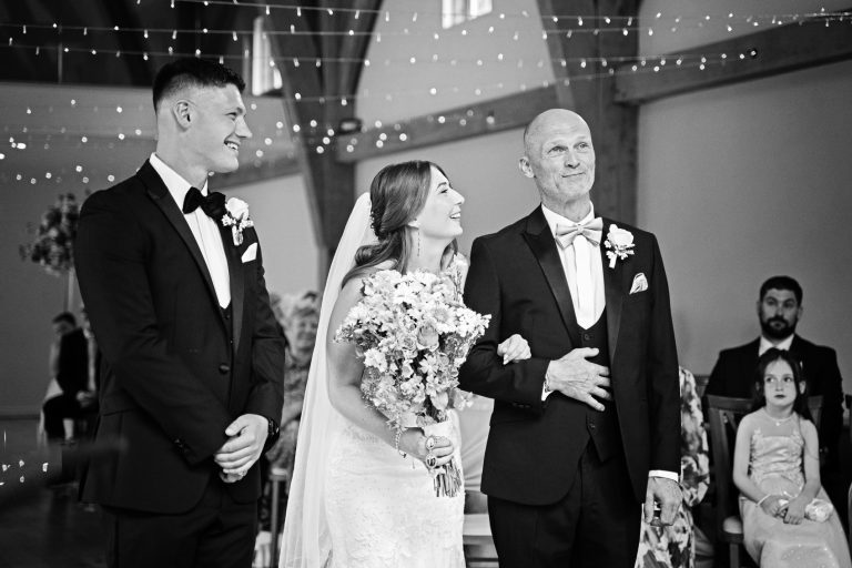 B&W photo of dad giving his daughter away.