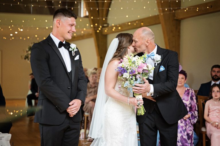 Father of the bride gives his daughter away at The Mill Barns.
