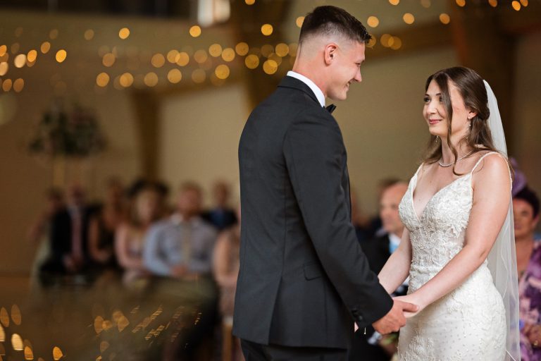 Bride and groom saying their wedding vows at The Mill Barns.